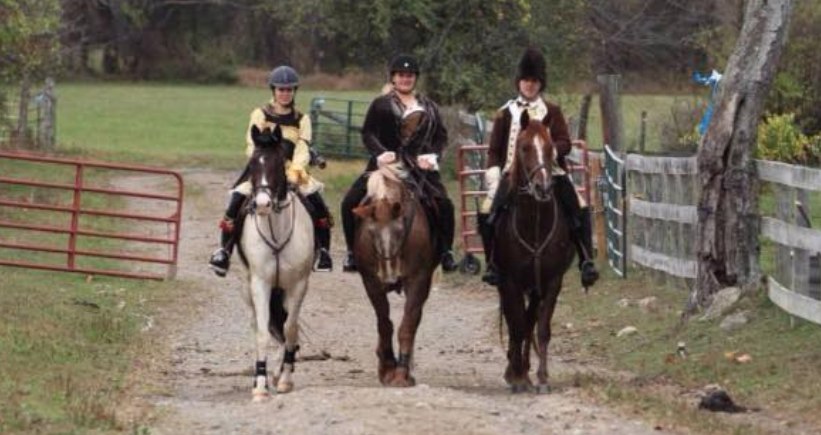 A team of three riders in costume at the hunter pace